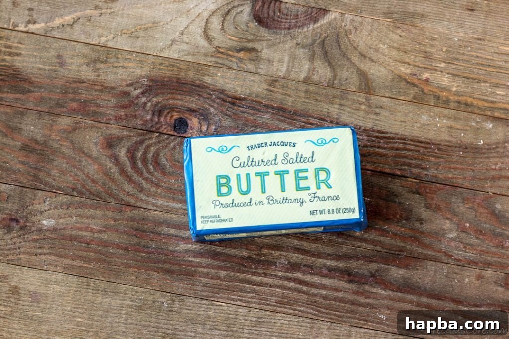 Golden Caramel Apple Tart 5 Block of French butter on a wooden board