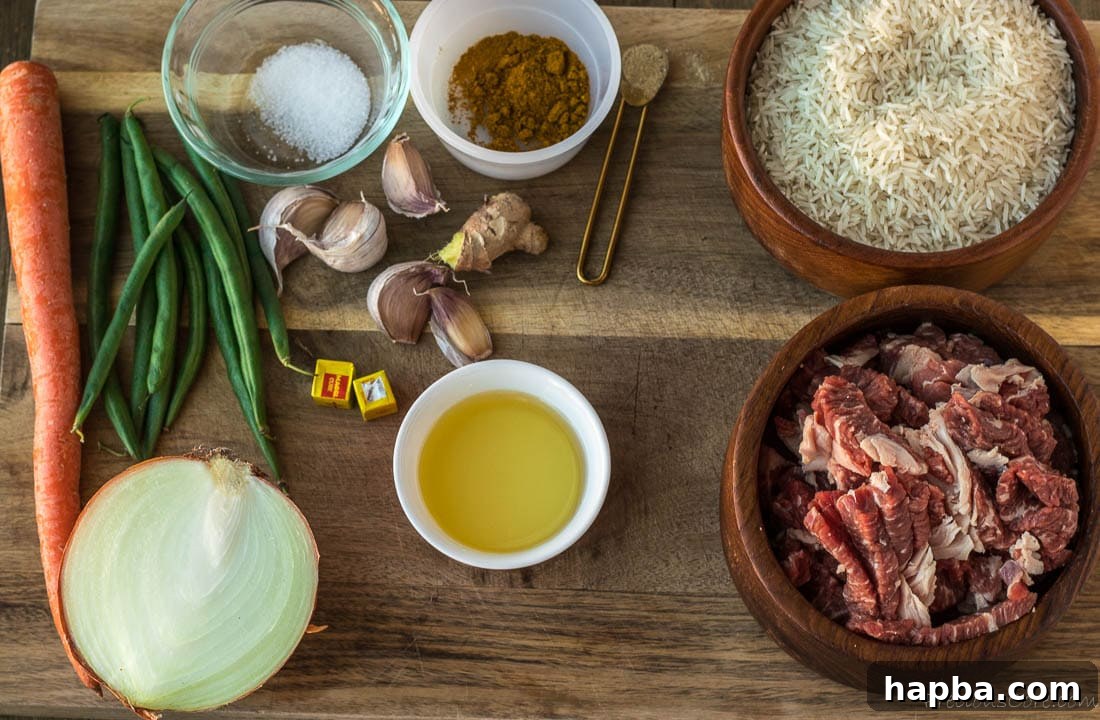 Array of fresh ingredients including beef, rice, spices, and oil on a wooden chopping board.