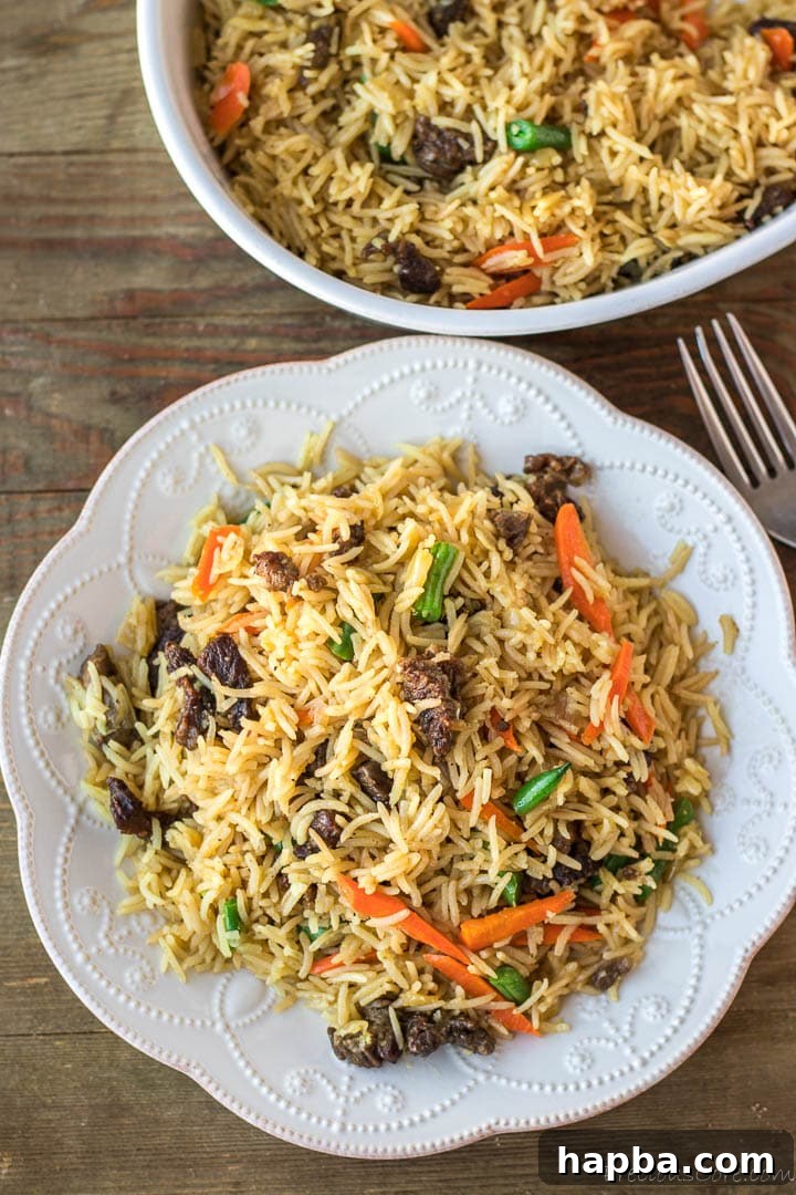 A beautifully plated dish of Beef Fried Rice, ready to be enjoyed.